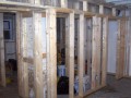 Framing of room divisions as basement apartment takes shape at home on Wisconsin Ave. NW near Washington National Cathedral.